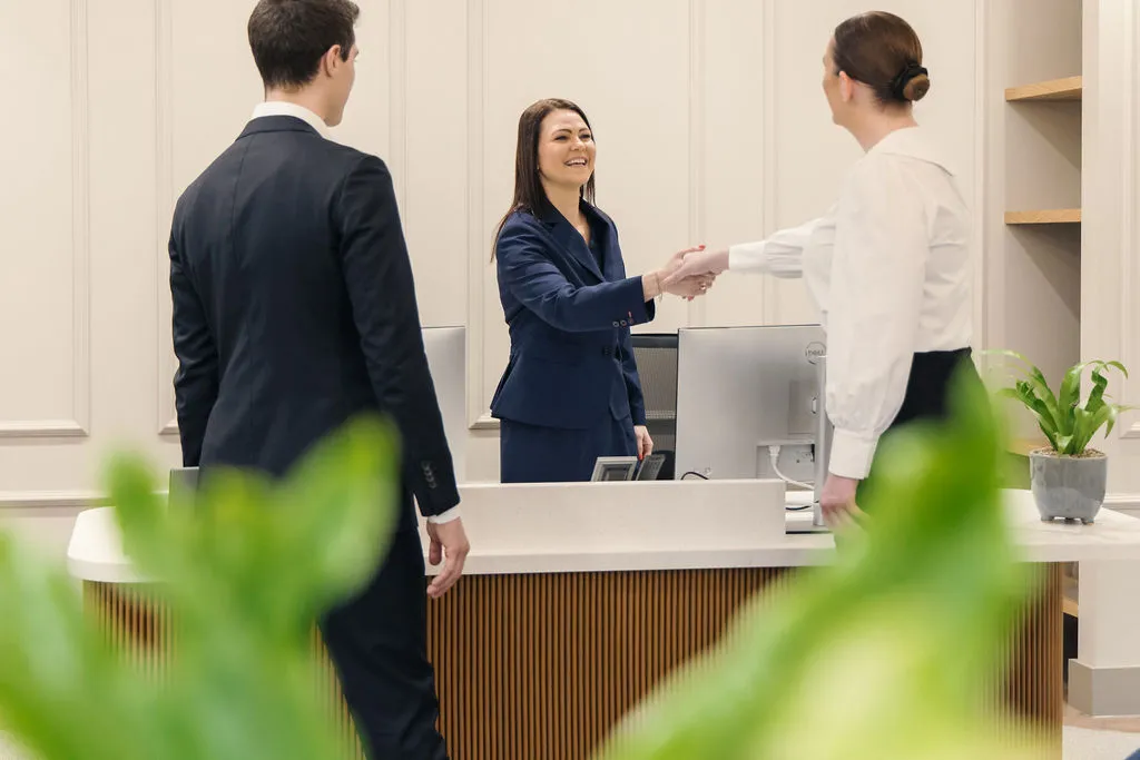 Two women greeting each other
