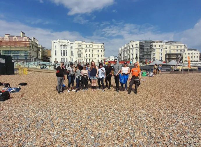 people cleaning the beach