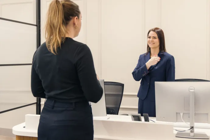 two women greeting each other